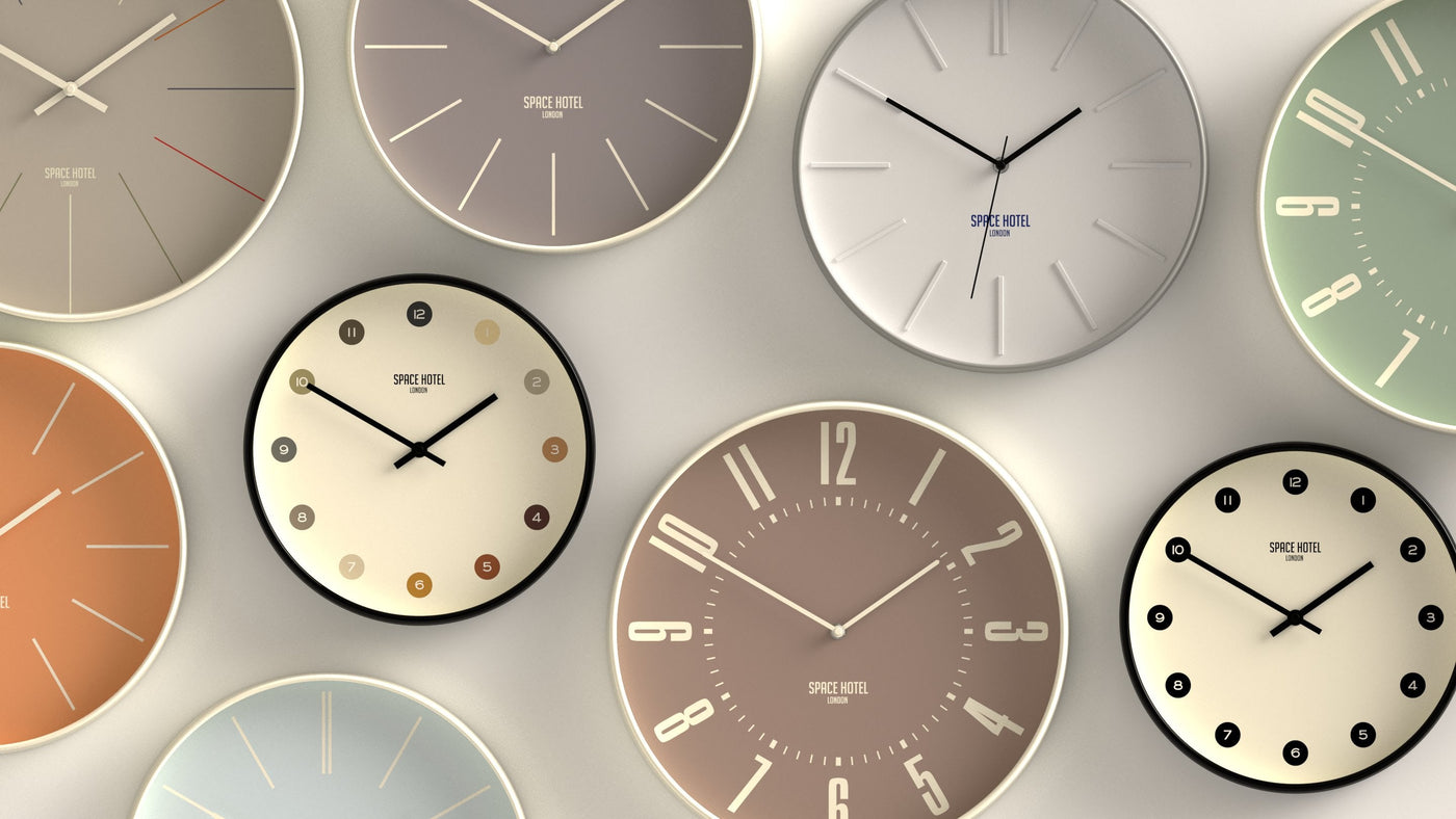 A colourful wall display of cool Space Hotel clocks